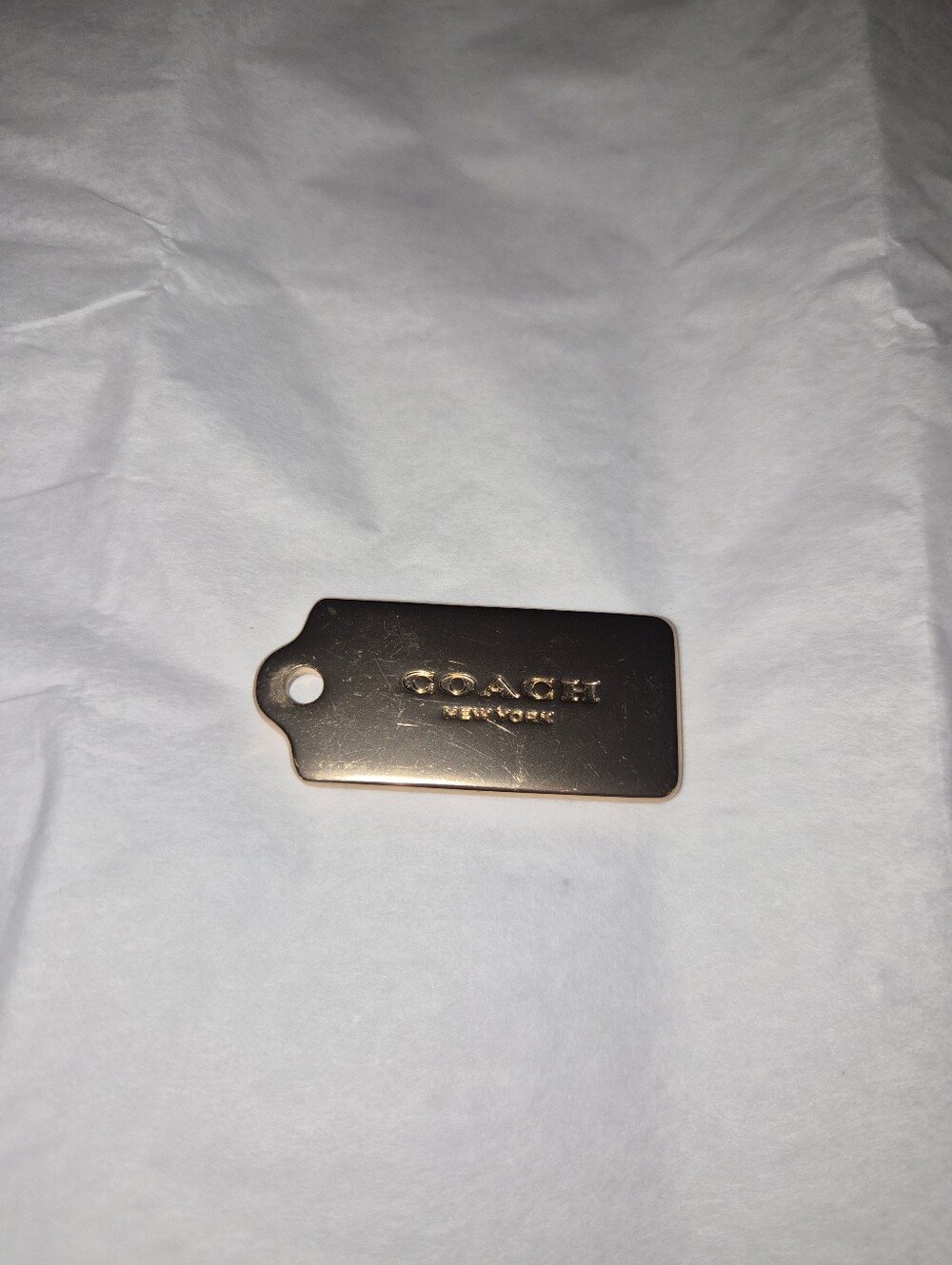 COACH Rose Gold Metal Tag Keychain - Stylish Accessory